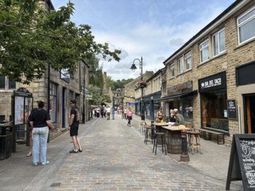 The cobbled pedestrianised street of Bridgegate in Hebden Bridge, a Happy Valley filming location