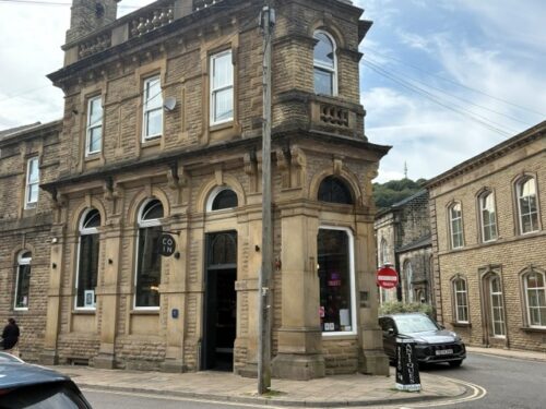 COIN wine bar on Albert Street in Hebden Bridge, a Riot Women filming location