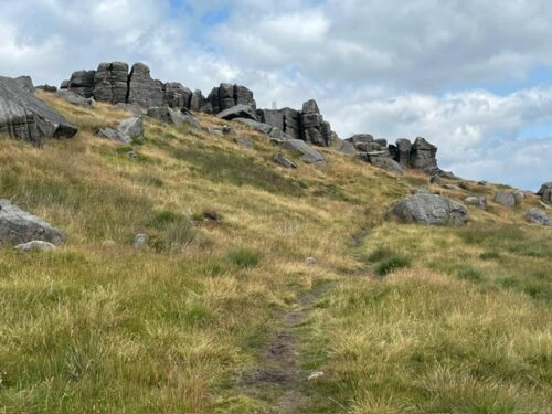 The moorland footpath leading up to the Bridestones rock formations near Todmorden