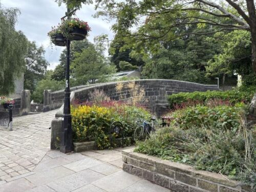 The old packhorse bridge over Hebden Water in Hebden Bridge, where Catherine and Ryan walk