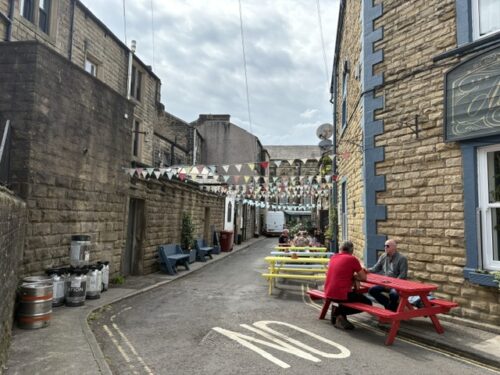 The outdoor seating area and bunting behind The Albert pub in Hebden Bridge